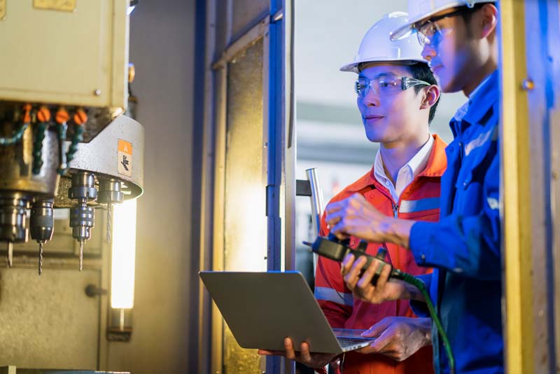 Male Asian engineer professional having a discussion standing c